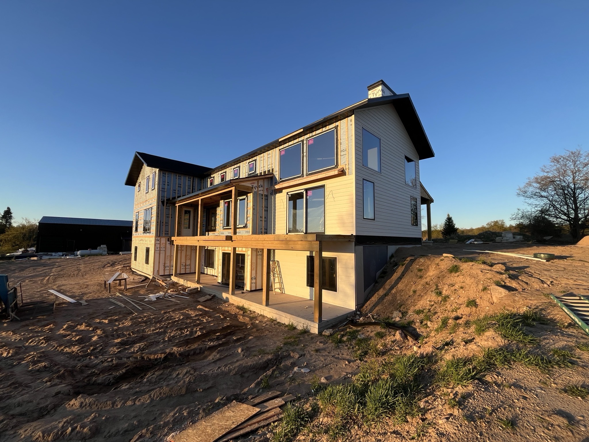 A Sativa Building Systems custom home under construction in Central Wisconsin at golden hour