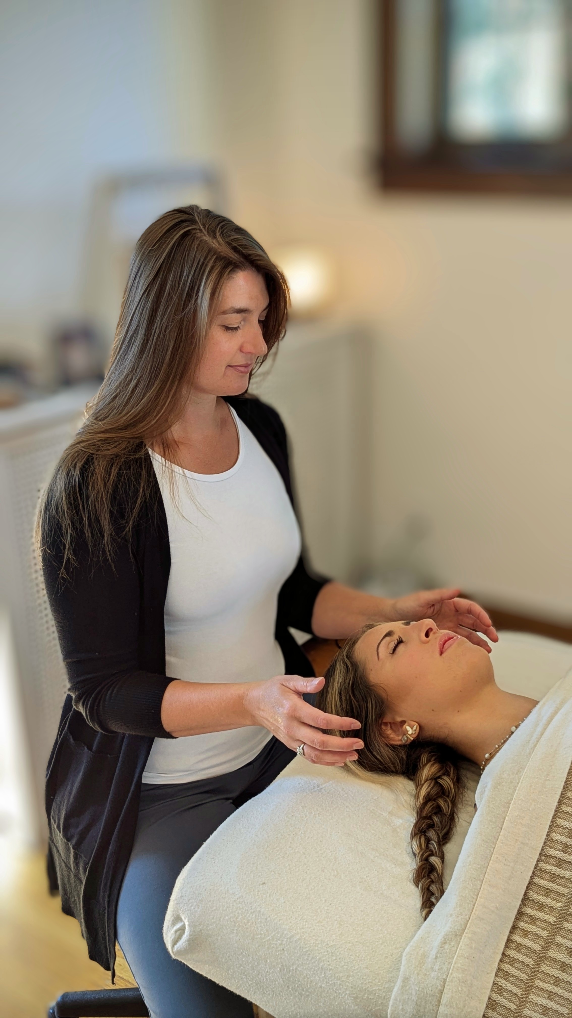 Holly facilitating a Reiki session