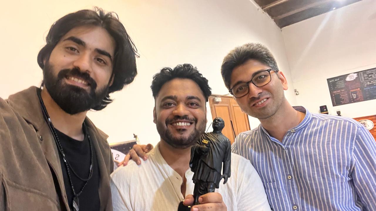 With colleagues and award
