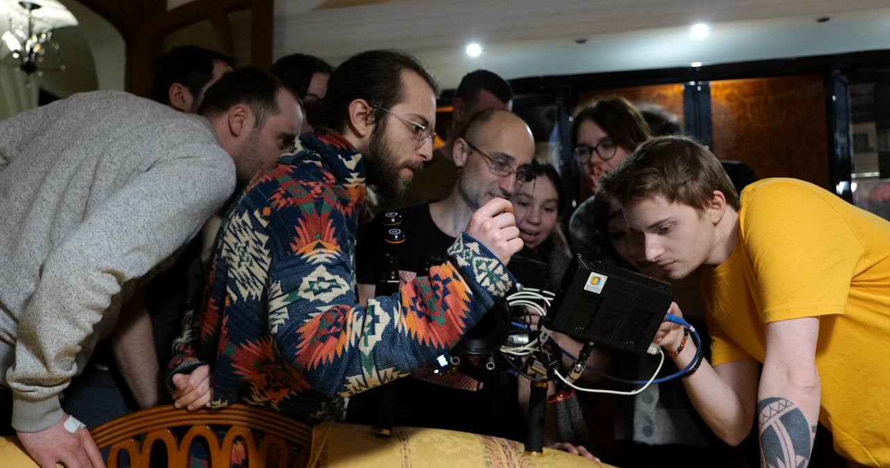 Behind the scenes — Valeriy Rudenko and crew at the monitor, closing frame