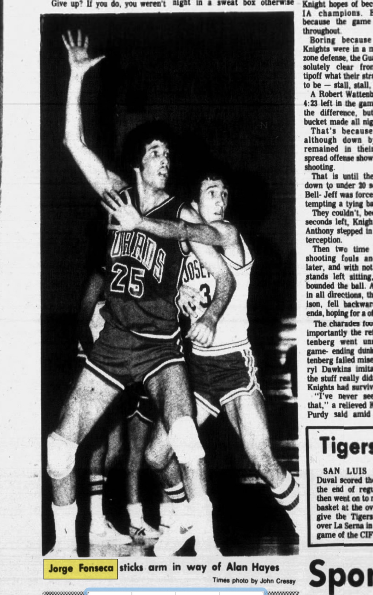 Jorge Fonseca sticks arm in way of Alan Hayes.