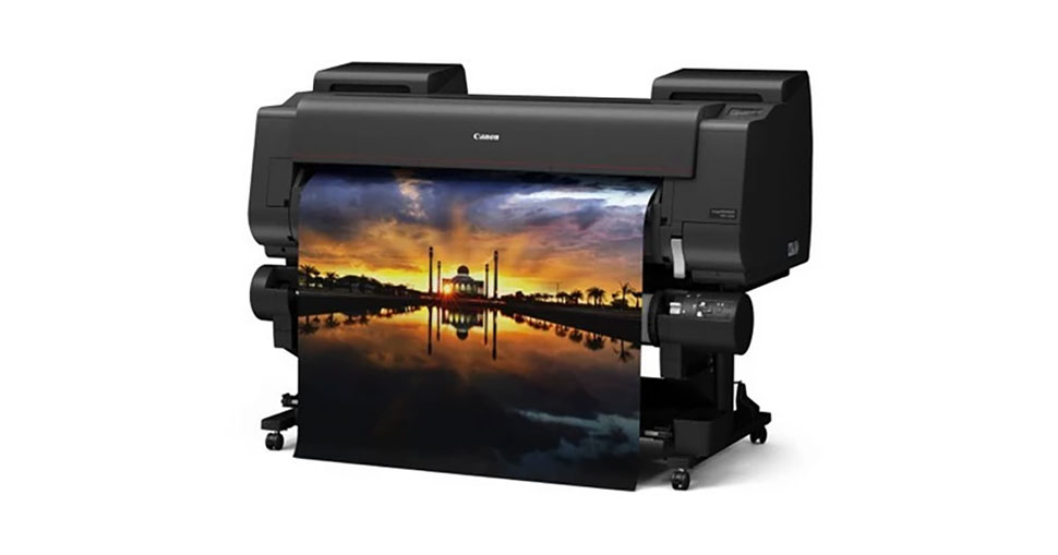 Professional wide-format printer producing a school poster