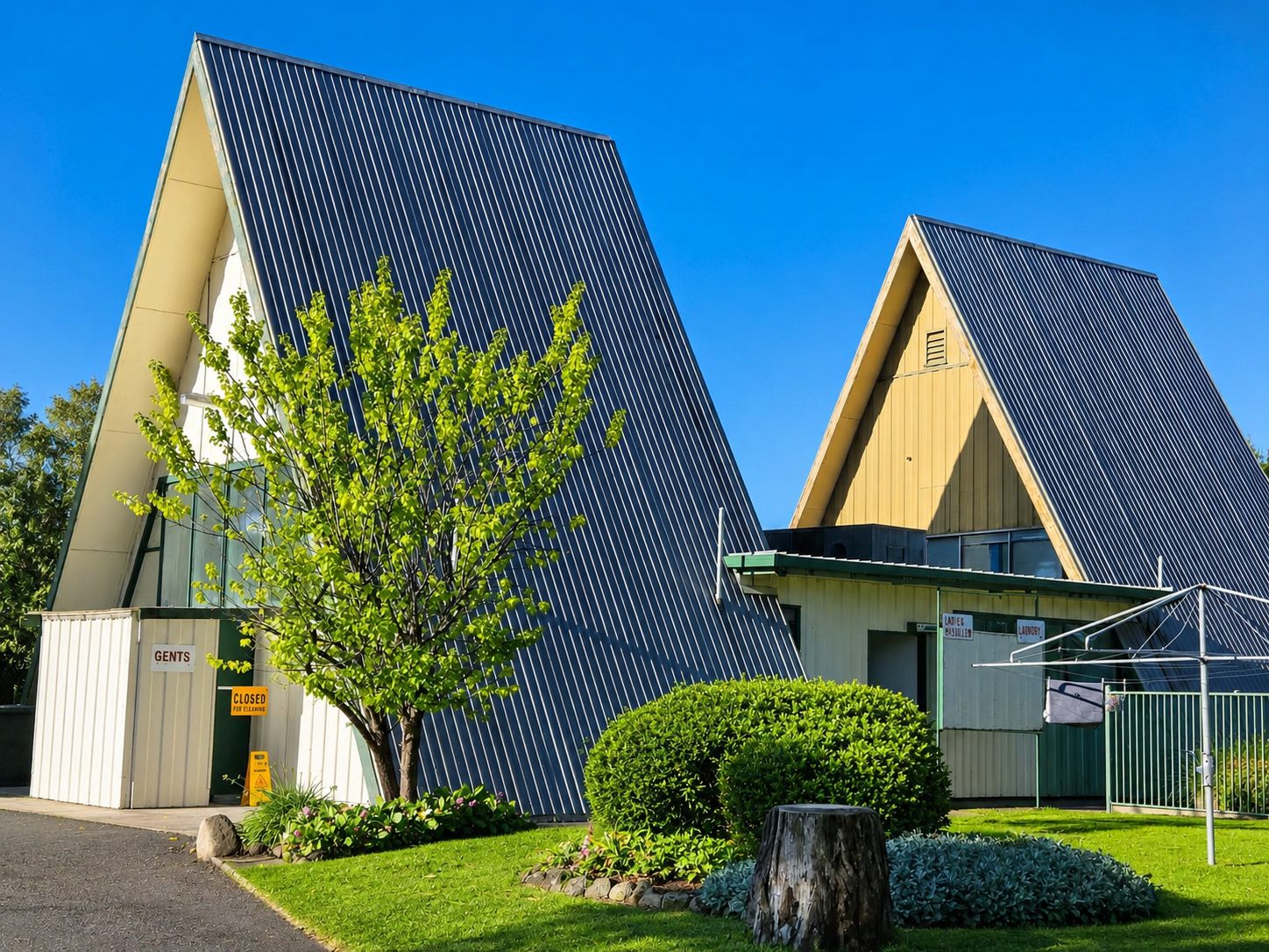 Iconic A-frame amenities block — gents, ladies and laundry