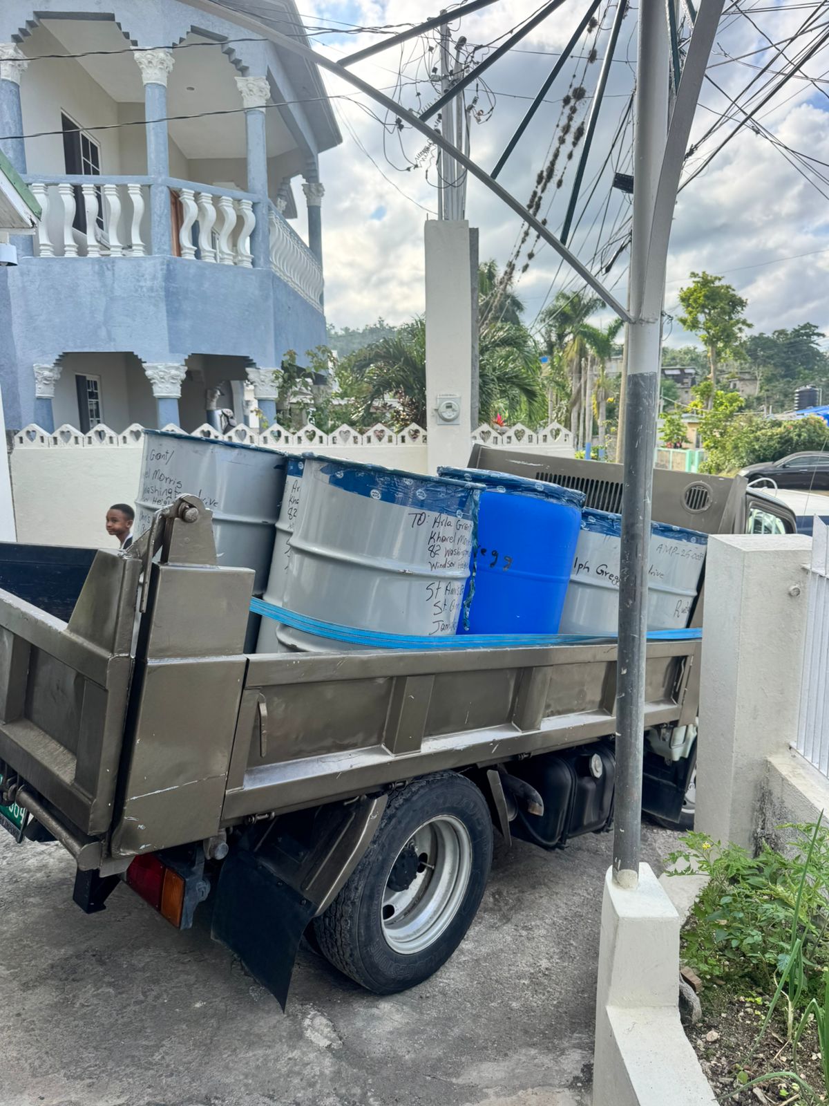 Jamaican truck loaded with cargo barrels in Linstead