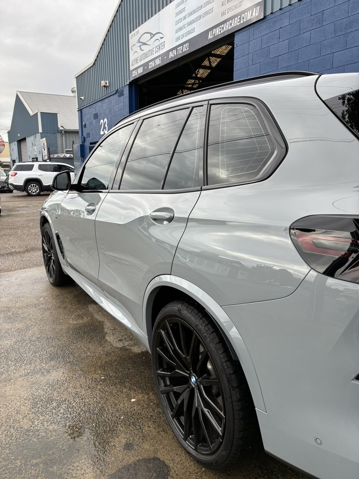 BMW X5 side profile — paint reflection