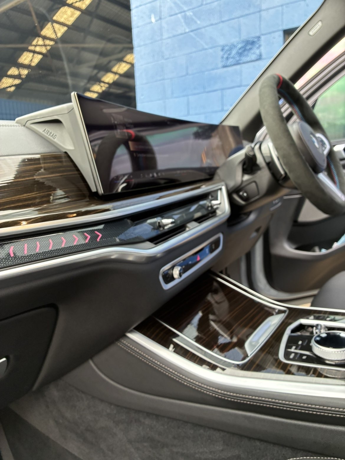 BMW X5 dashboard side view — crystal-clear glossy finish