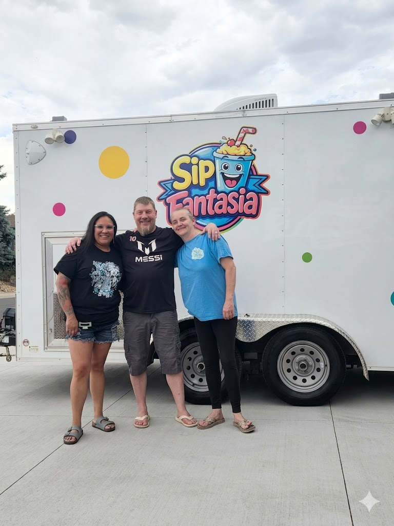 The Sip Fantasia Team - Chad, Danni, and Alicia in front of the Sip Fantasia trailer