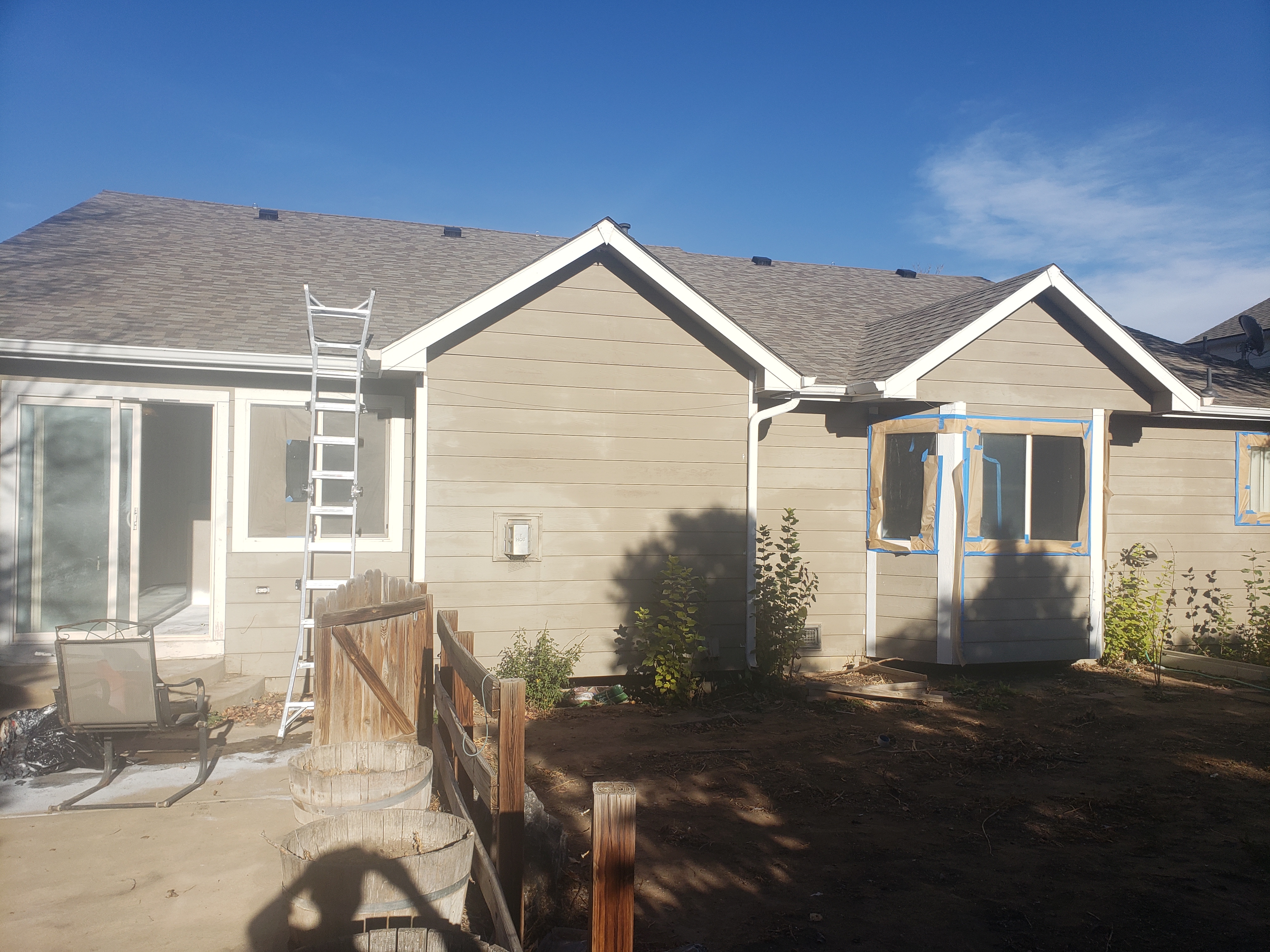Exterior house painting in progress