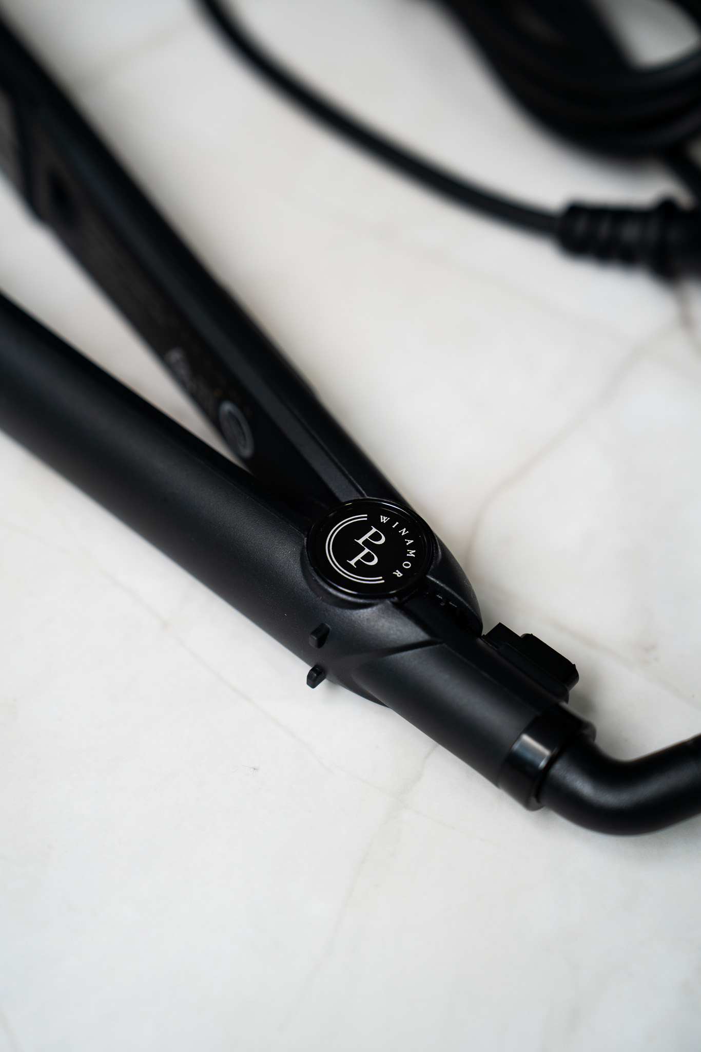 Winamor Perfect Pass keratin iron on marble surface showing premium rose gold design and Winamor logo