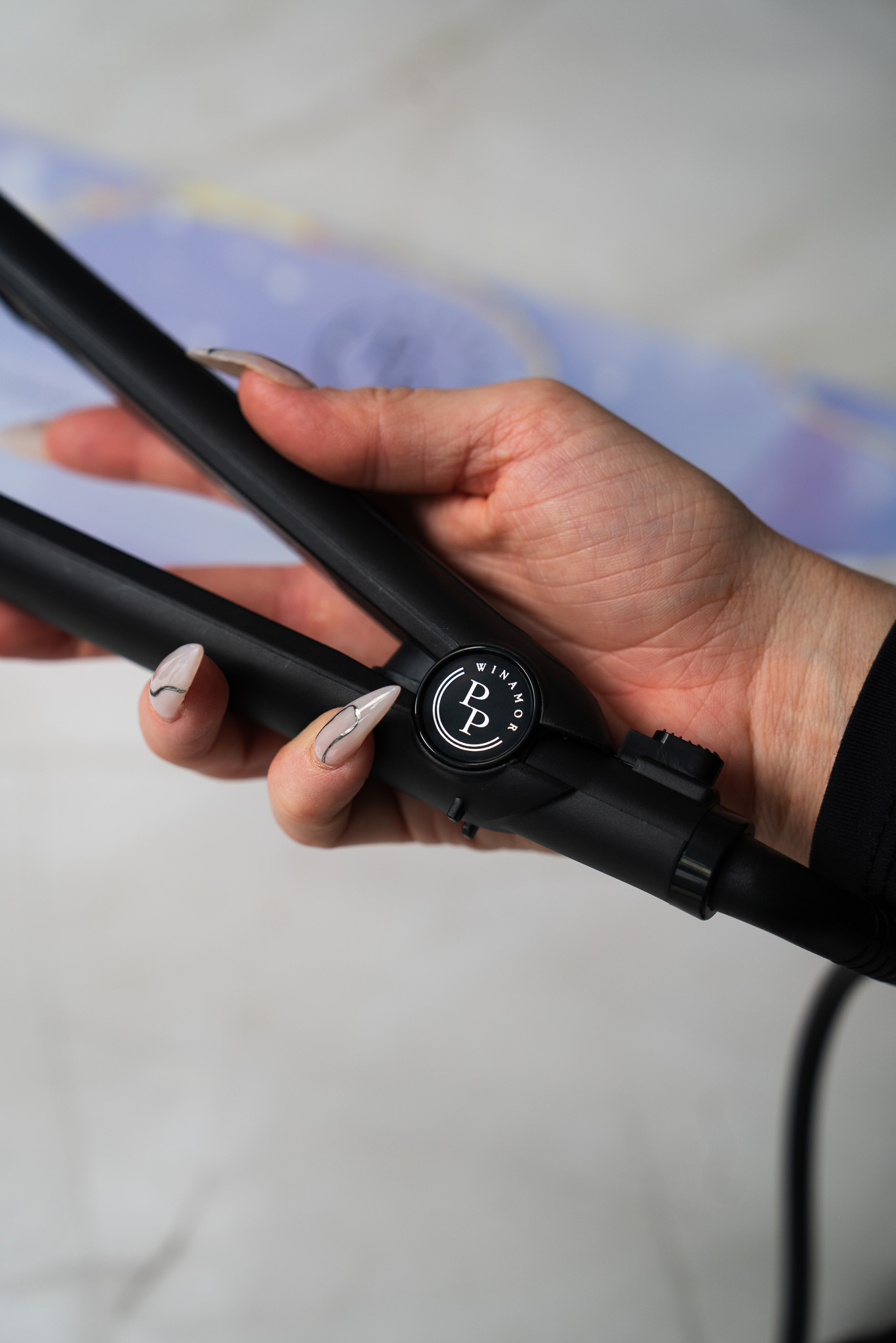 Professional hairdresser holding Winamor Perfect Pass keratin iron ready for salon keratin treatment