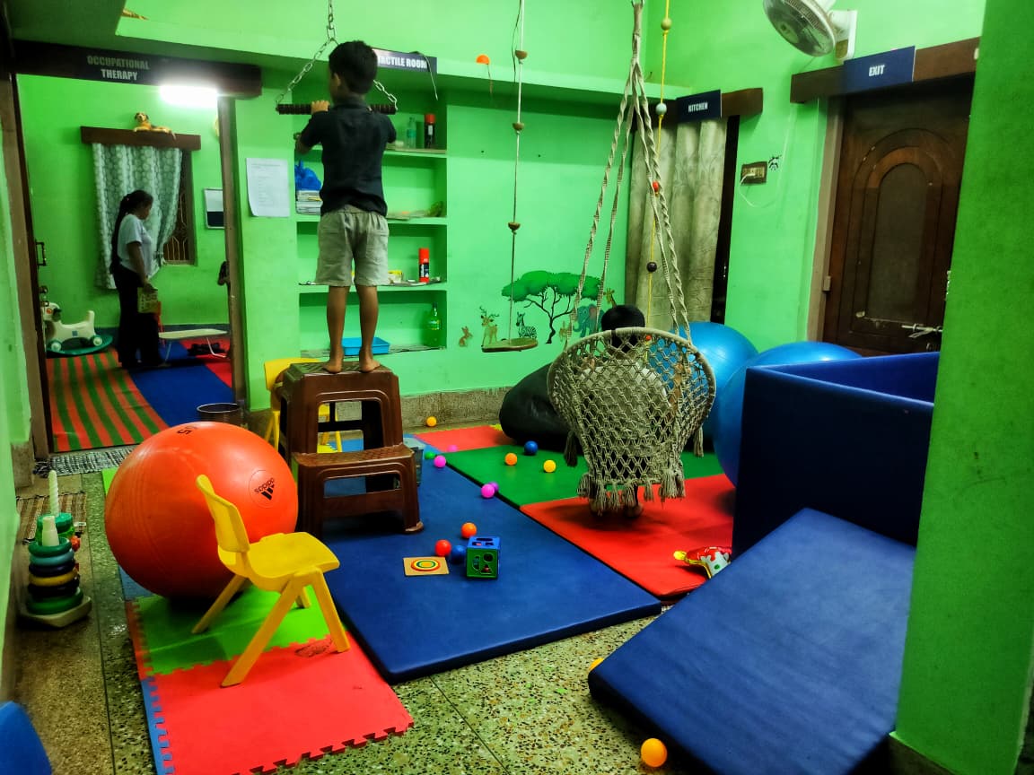 Occupational therapy room with child exercising