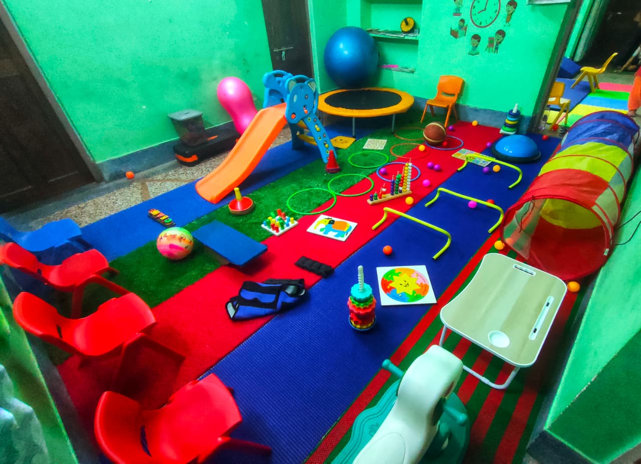 Therapy room with slides and toys