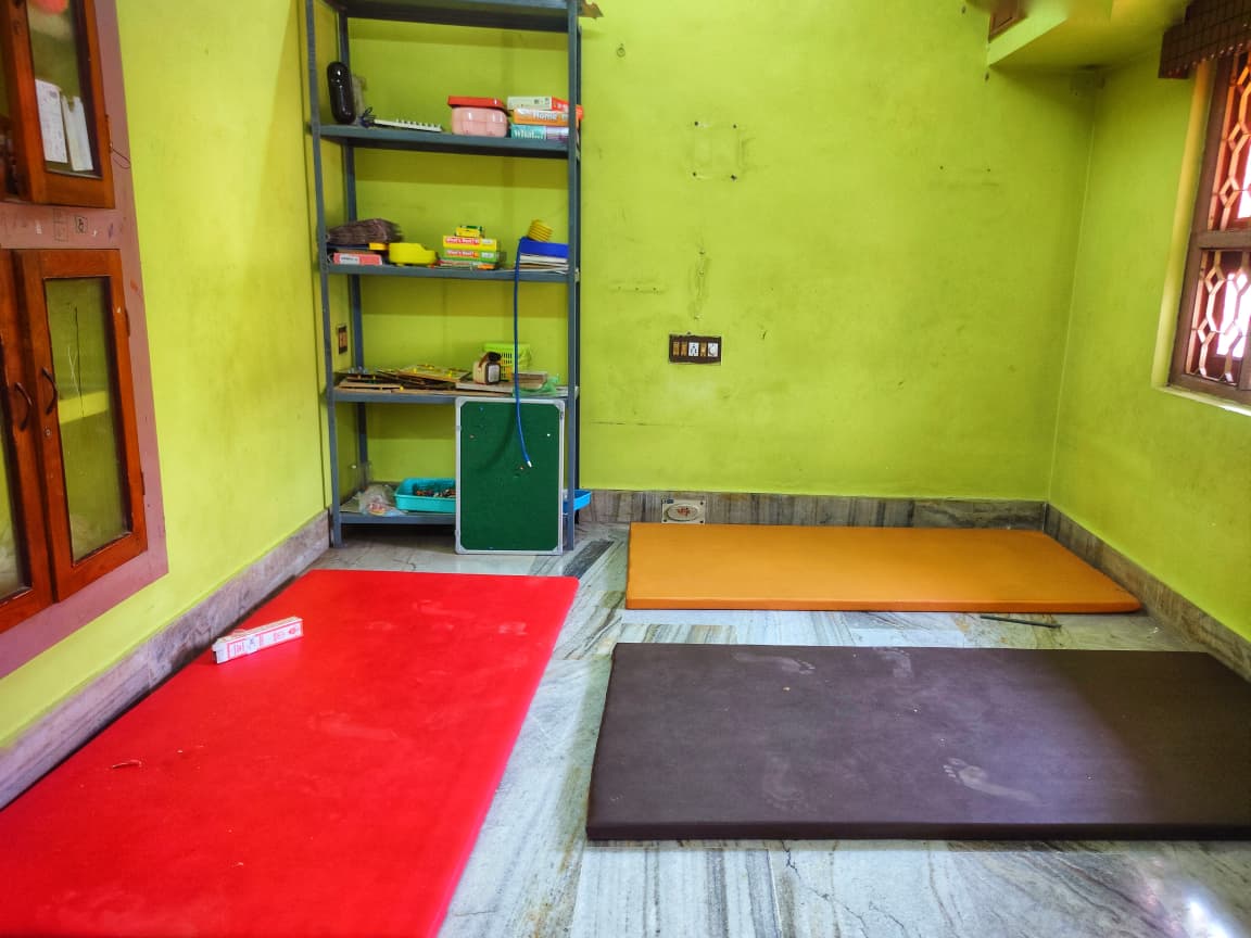 Therapy room with mats and learning materials