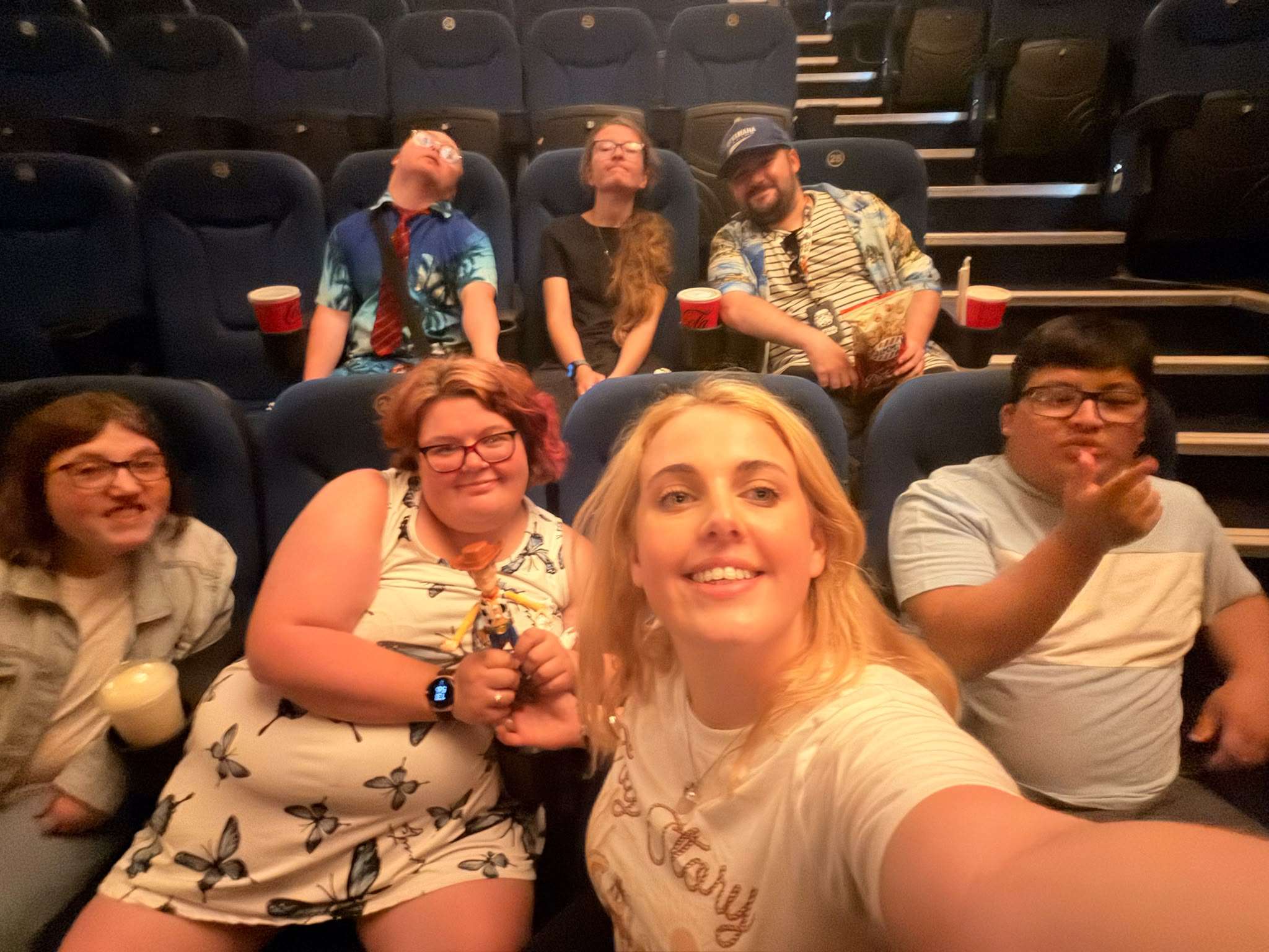 A group from Spire Inclusion enjoying a trip to the cinema together in the community.