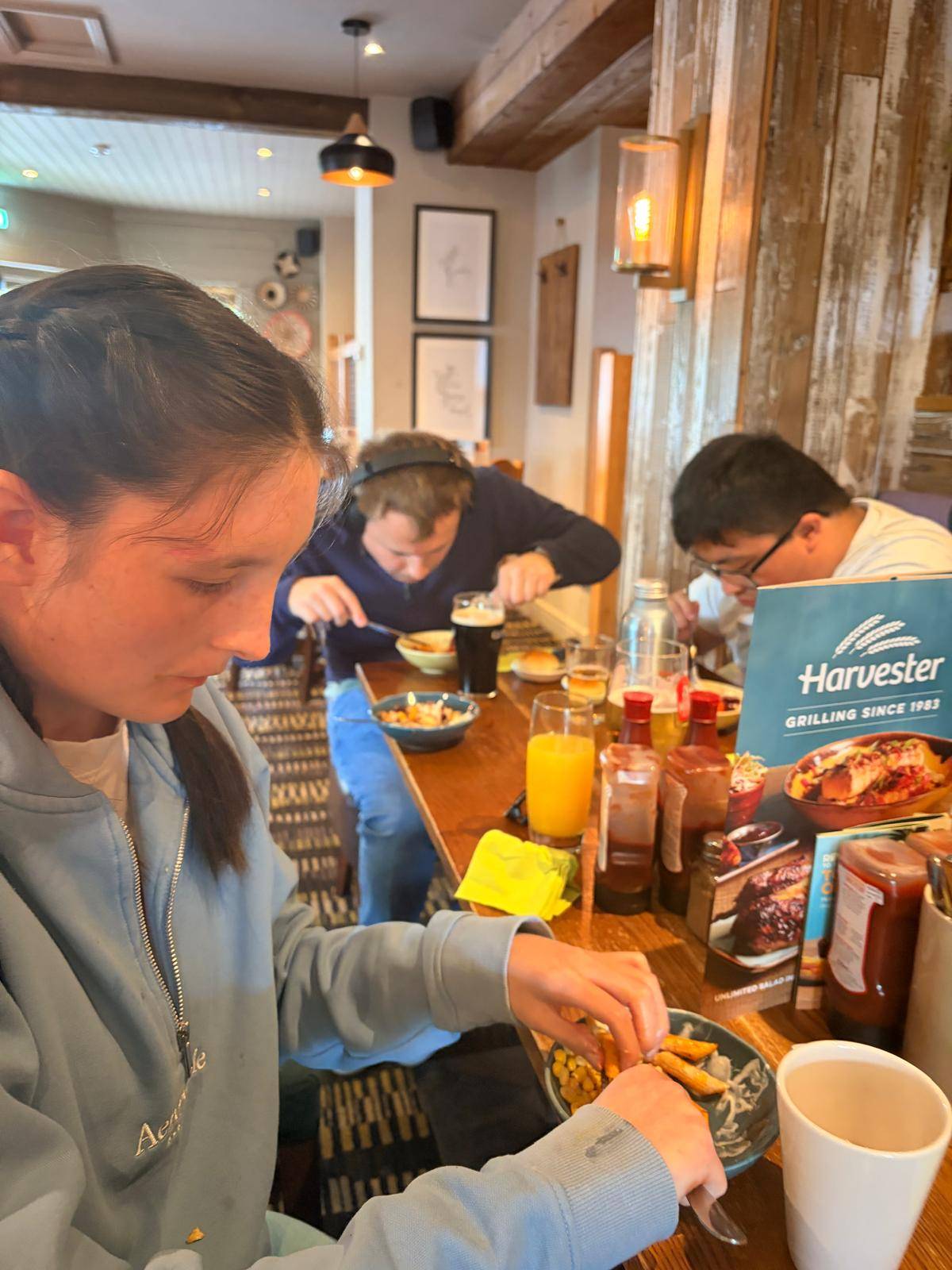 A group from Spire Inclusion enjoying a meal out together at a Harvester restaurant.