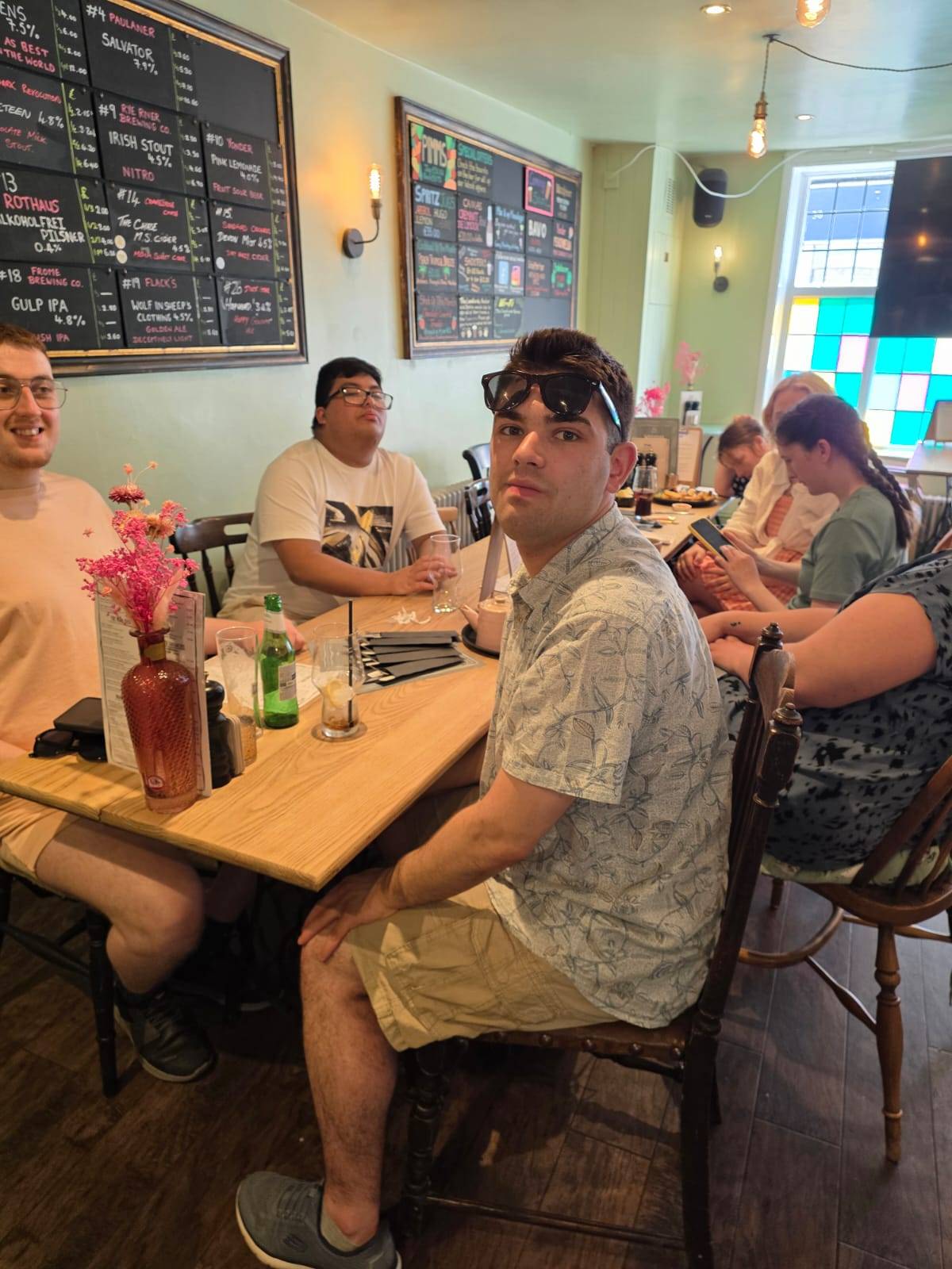 A group from Spire Inclusion enjoying a sociable meal out together at a local pub.