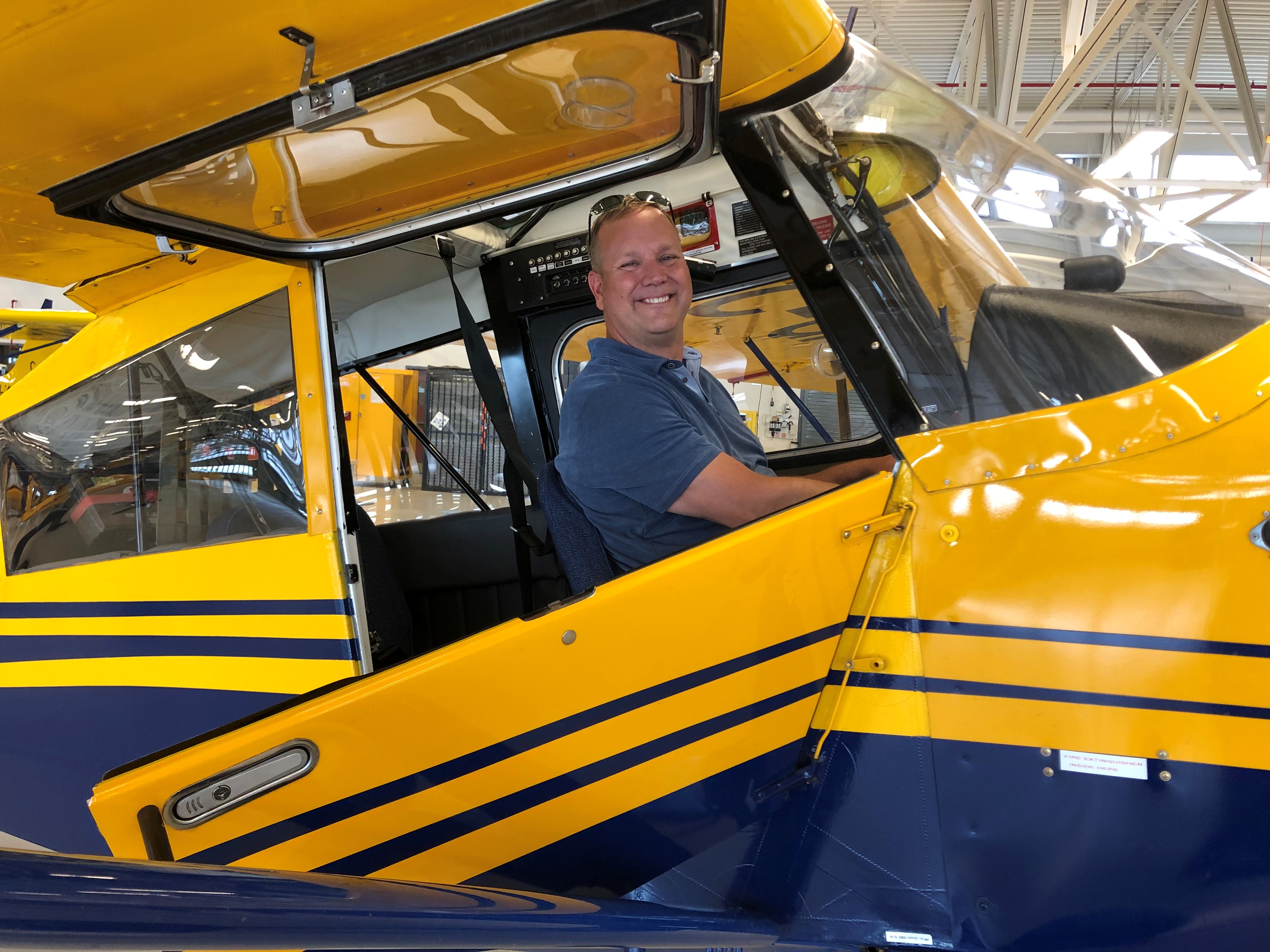 Mike at the controls of a Bellanca Scout