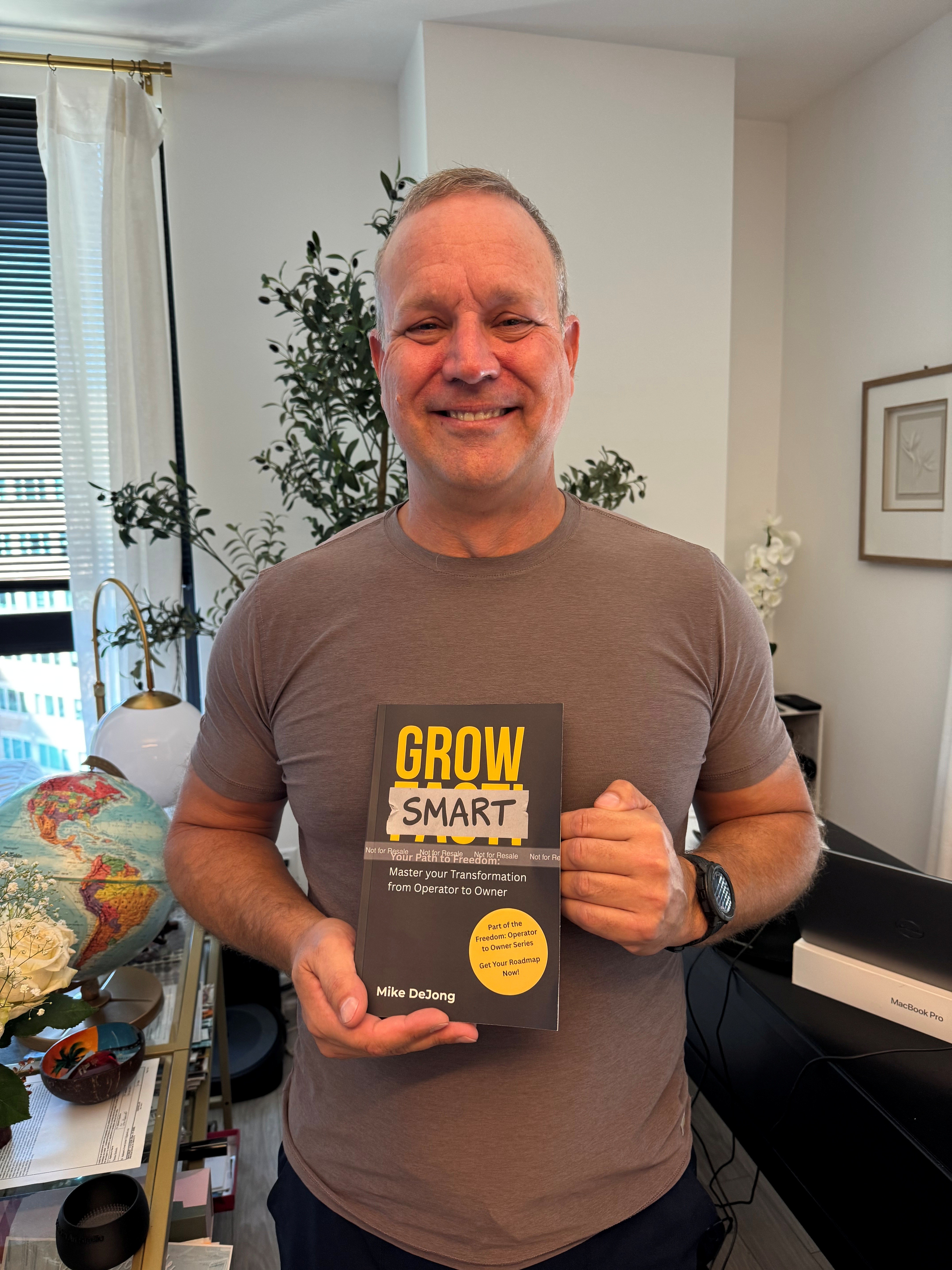 Mike DeJong holding Grow Smart