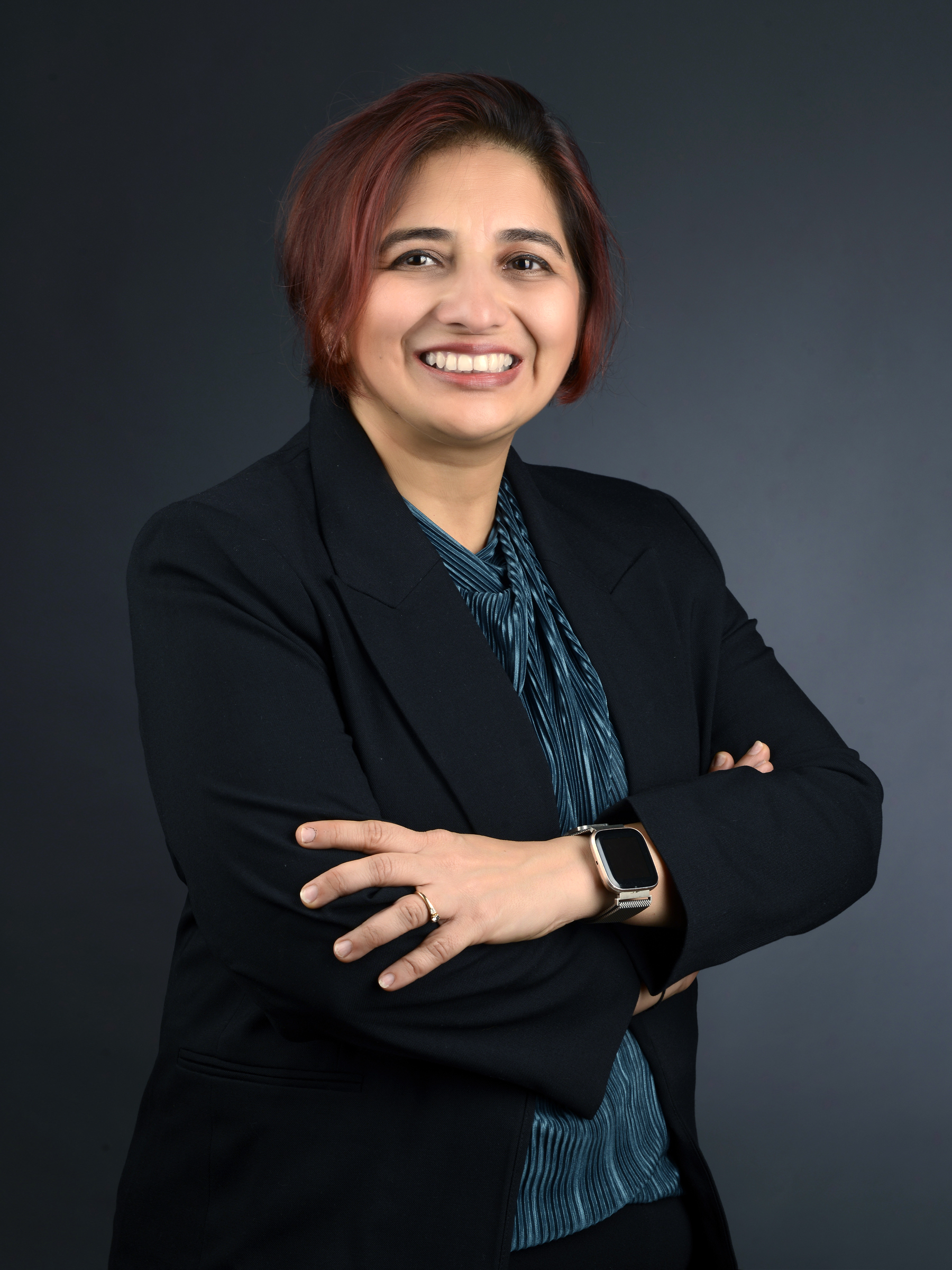 Hemangi Shah — confident, arms crossed