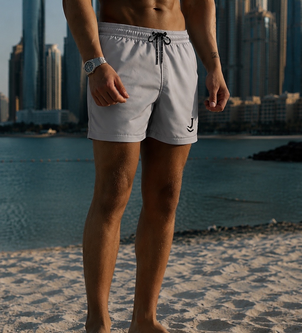 JALASS — man wearing light grey swim shorts on the beach
