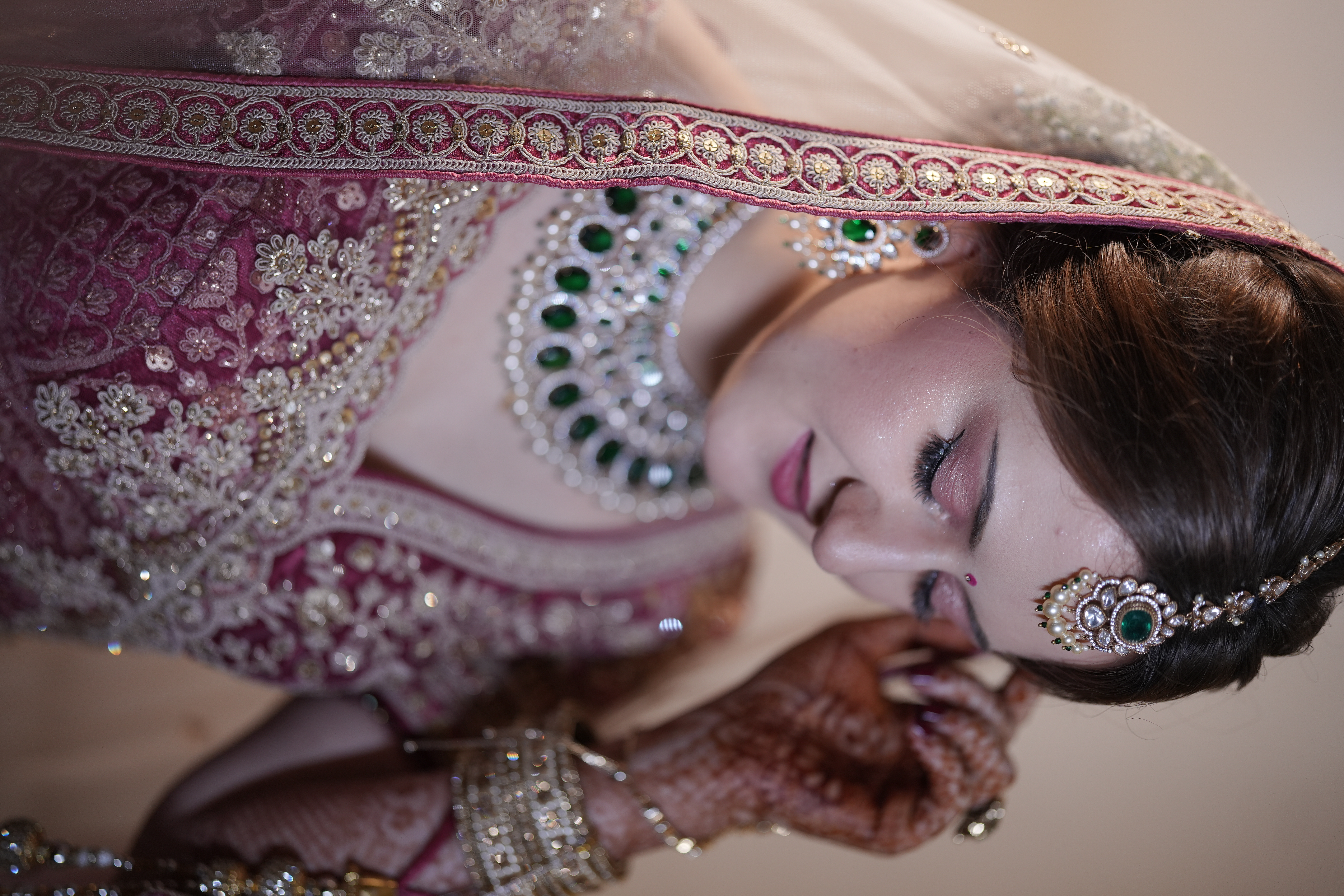 German bride candid reception moment with maang tikka and bangles styled by La Helen's Beauty Salon Coimbatore Tamil Nadu