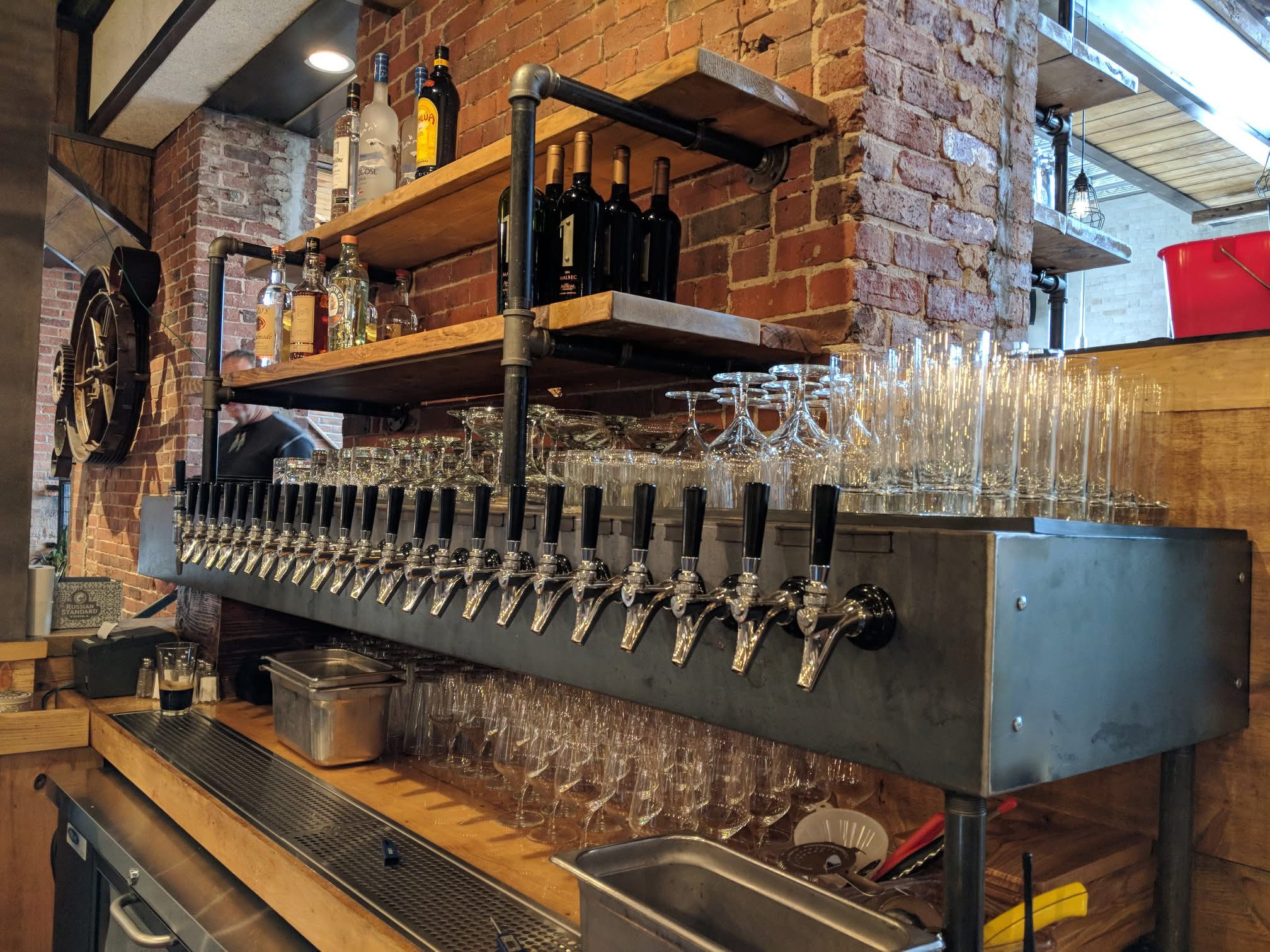 Brick wall tap system with glassware