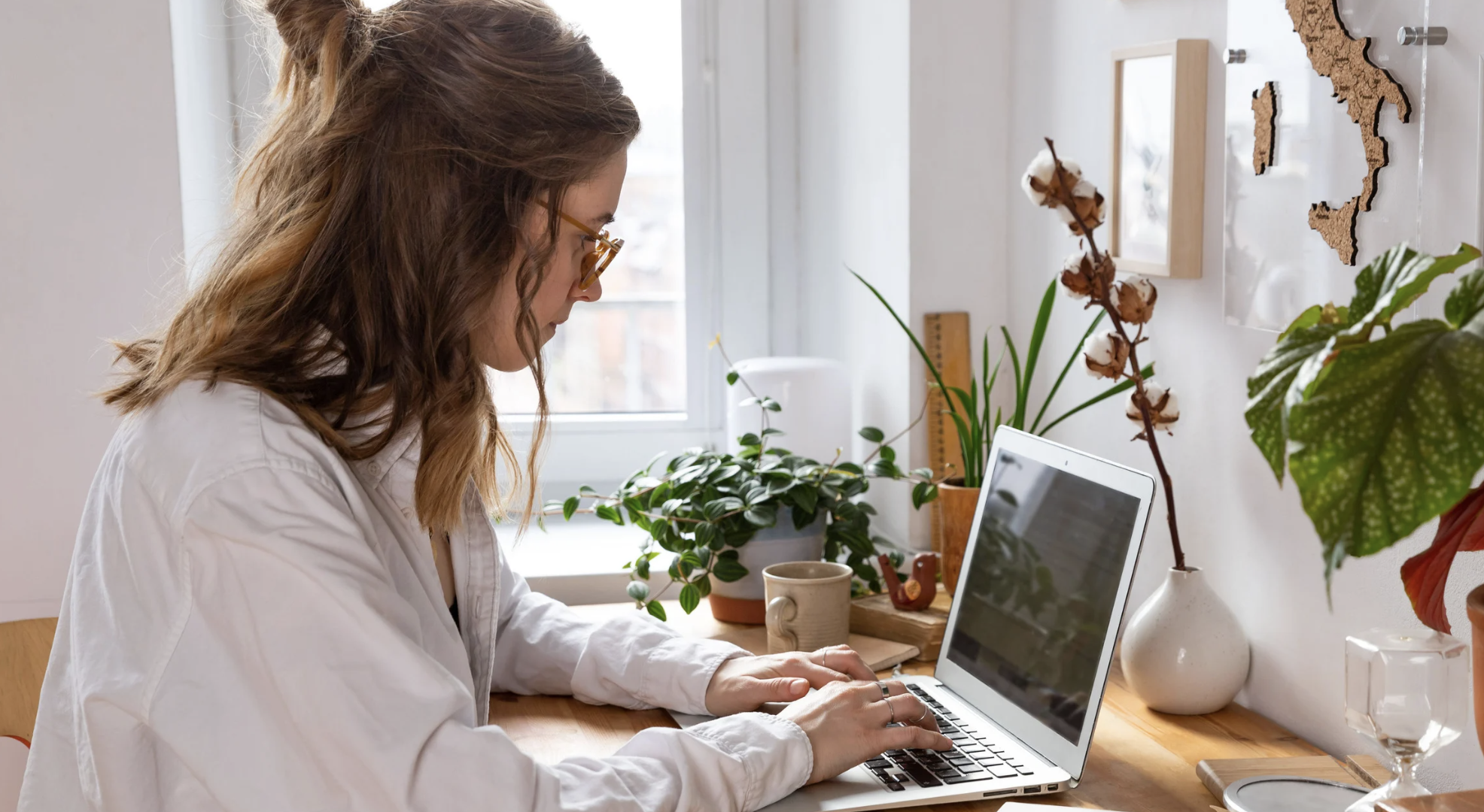 A manager at her desk in warm natural light