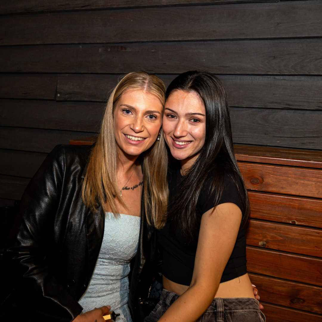 Two mates posing in the booth