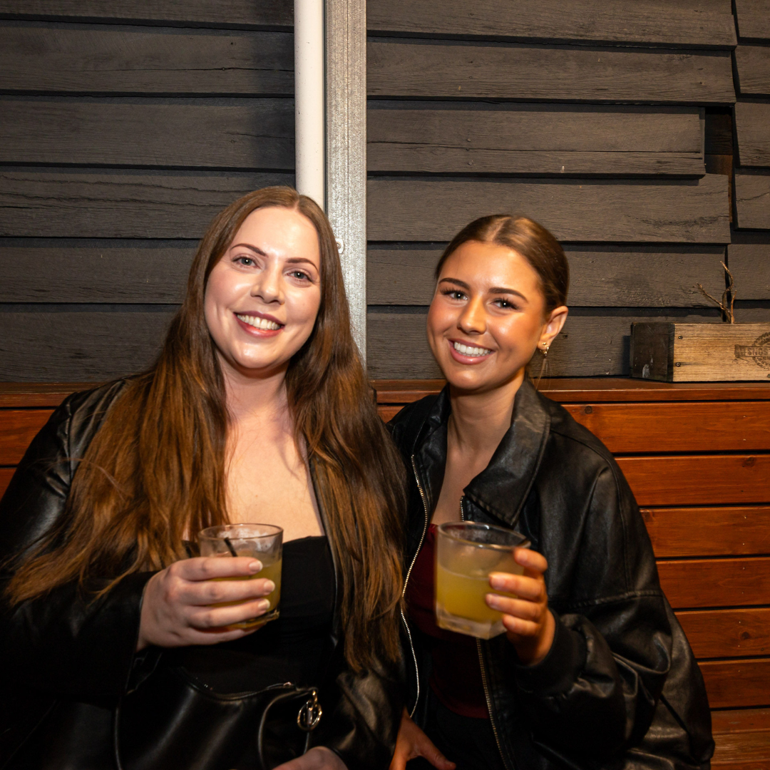Two regulars with cocktails