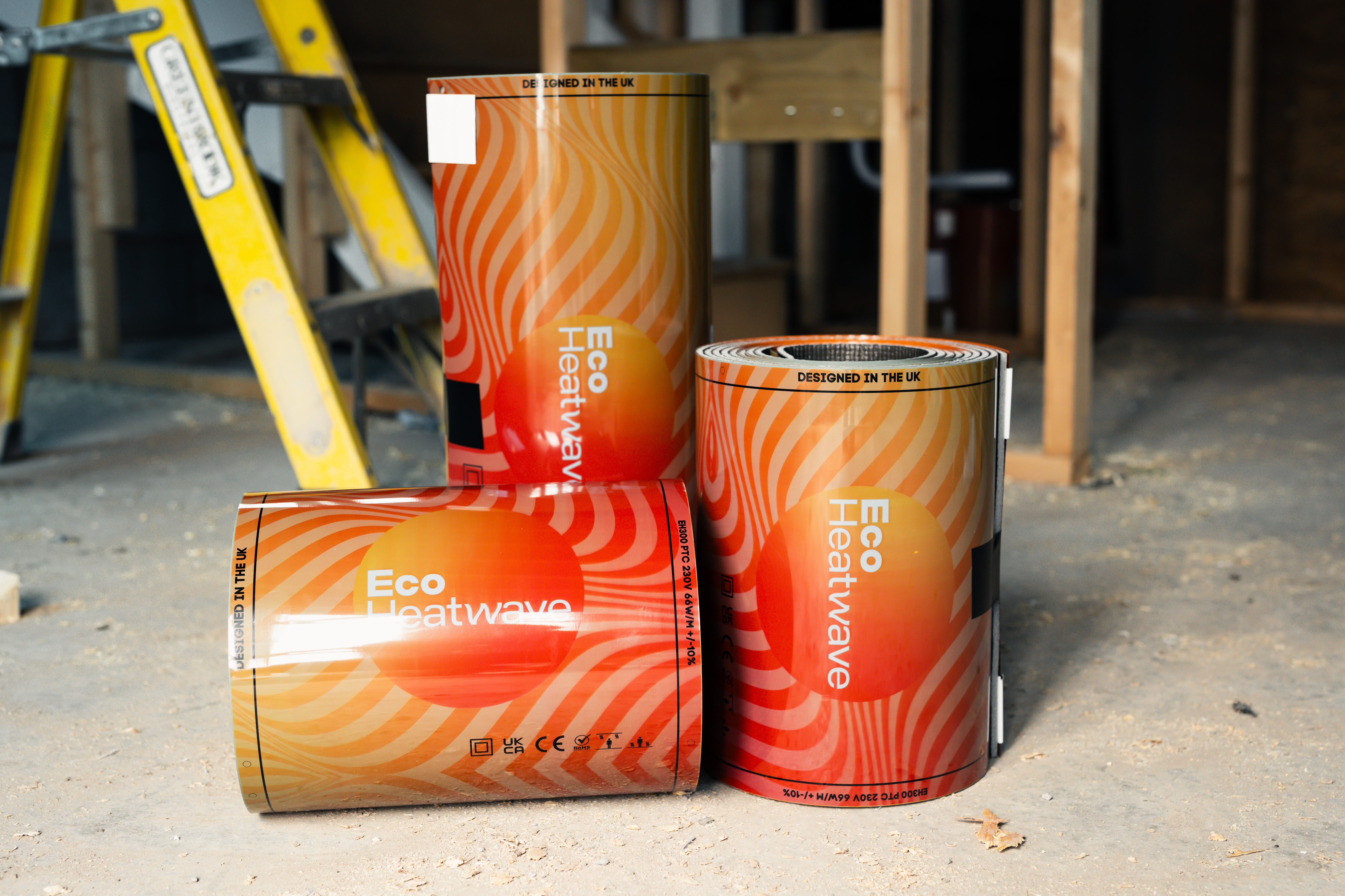 Three rolls of ecoHeatwave thin film carbon heating on a UK construction site
