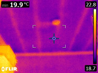 Wall / ceiling corner showing the characteristic geometric cold spot — a classic thermal bridge picked up in the assessment and flagged in the costed improvement schedule