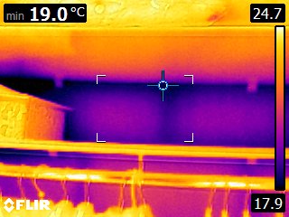 Loft / eaves zone — missing or compressed insulation visible as cold area