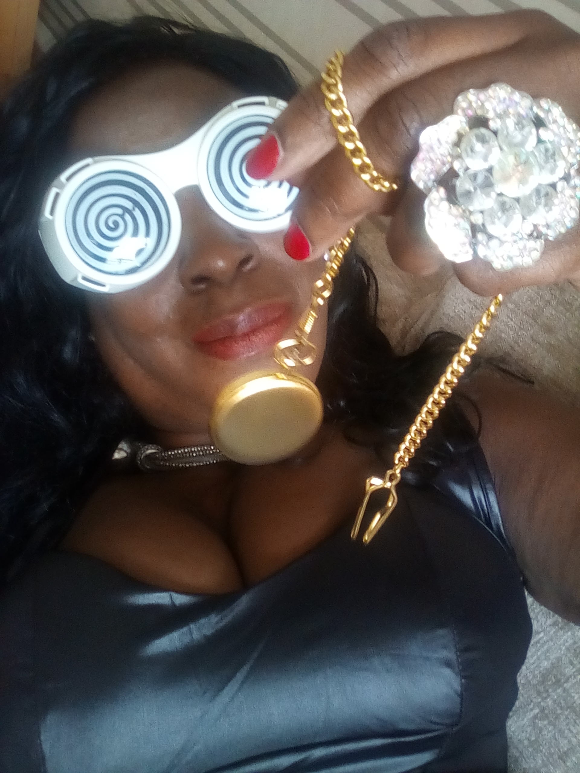 Queen Cleopatra with hypno-spiral glasses and gold pocket watch