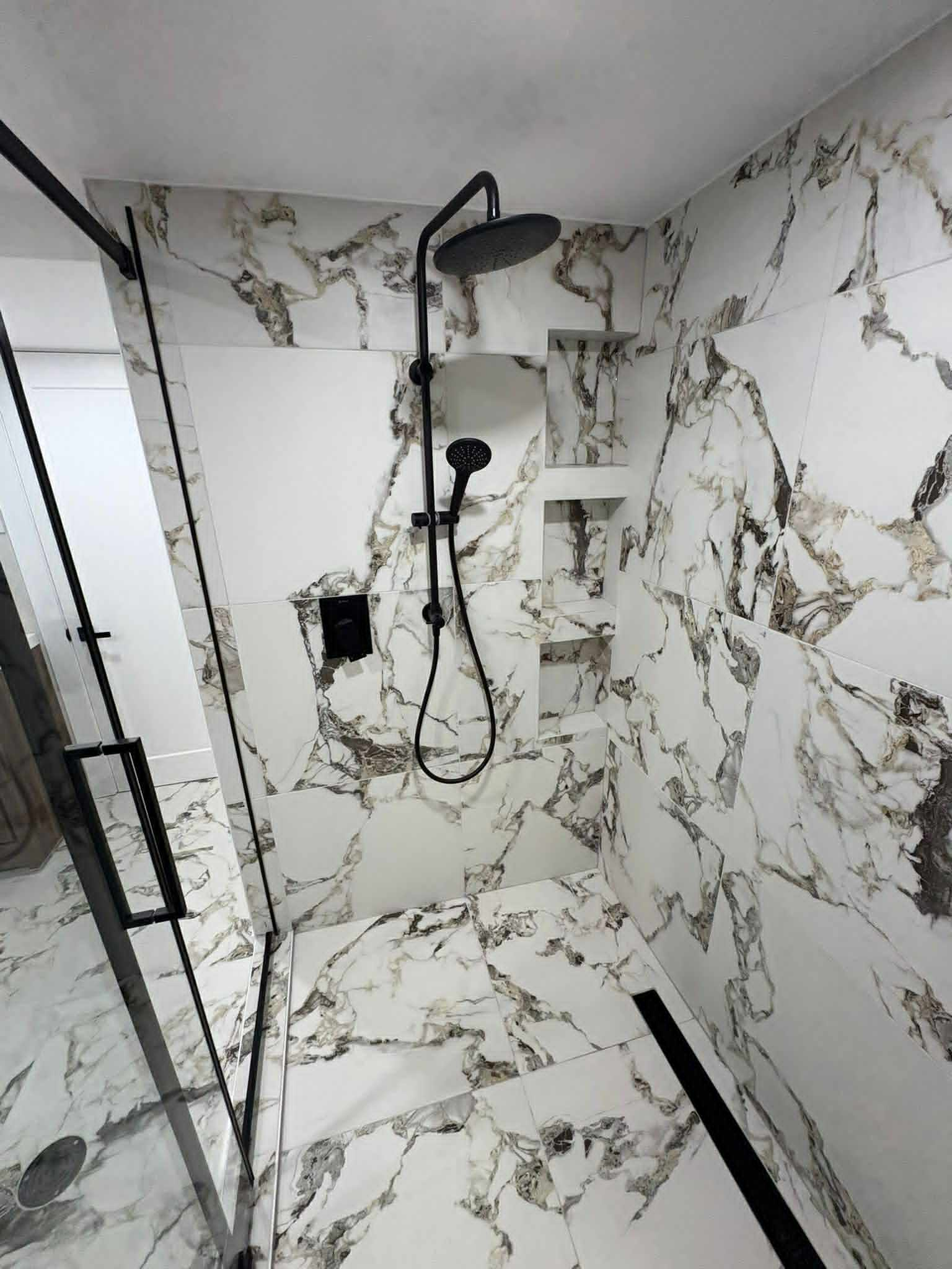 Premium calacatta marble walk-in shower built by Cresta Bath & Tile
