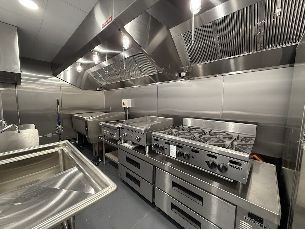 Commercial kitchen interior - prep and wash stations