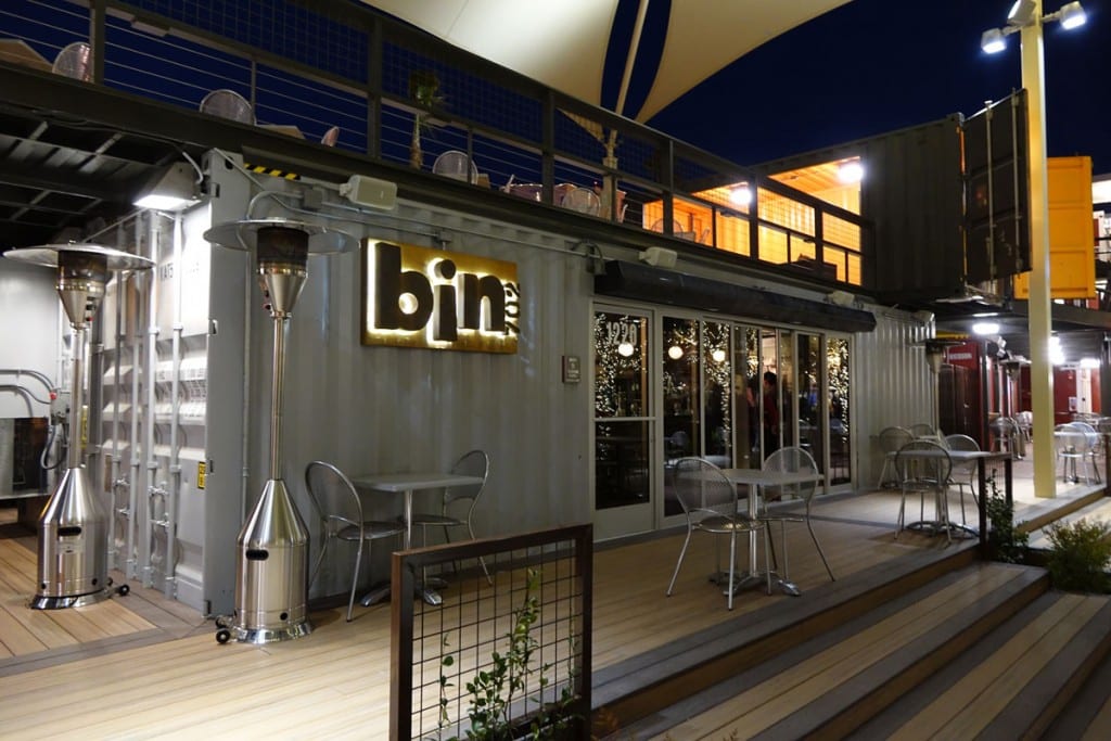 Bin 702 container wine bar at night