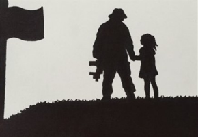 Soldier and child silhouette by an American flag