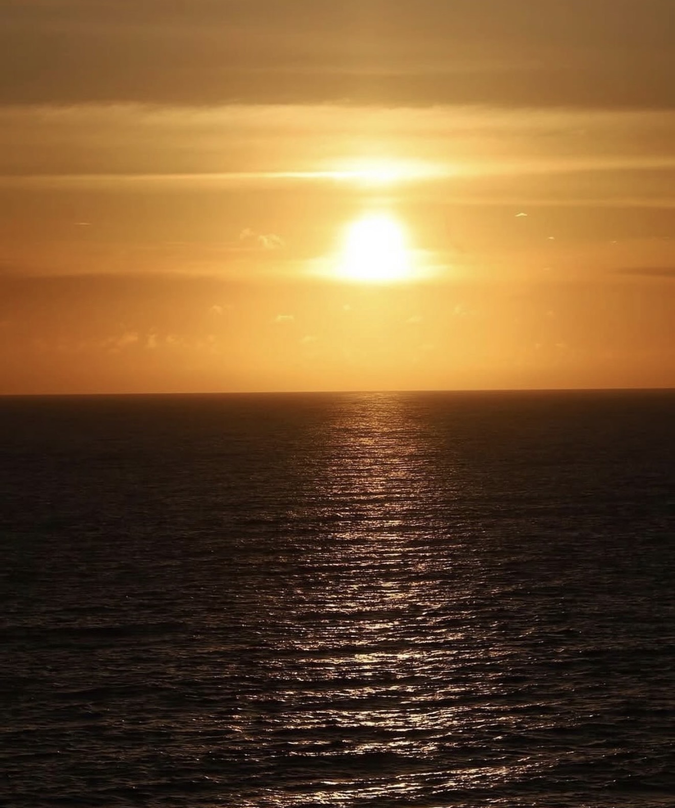 Golden hour over open water