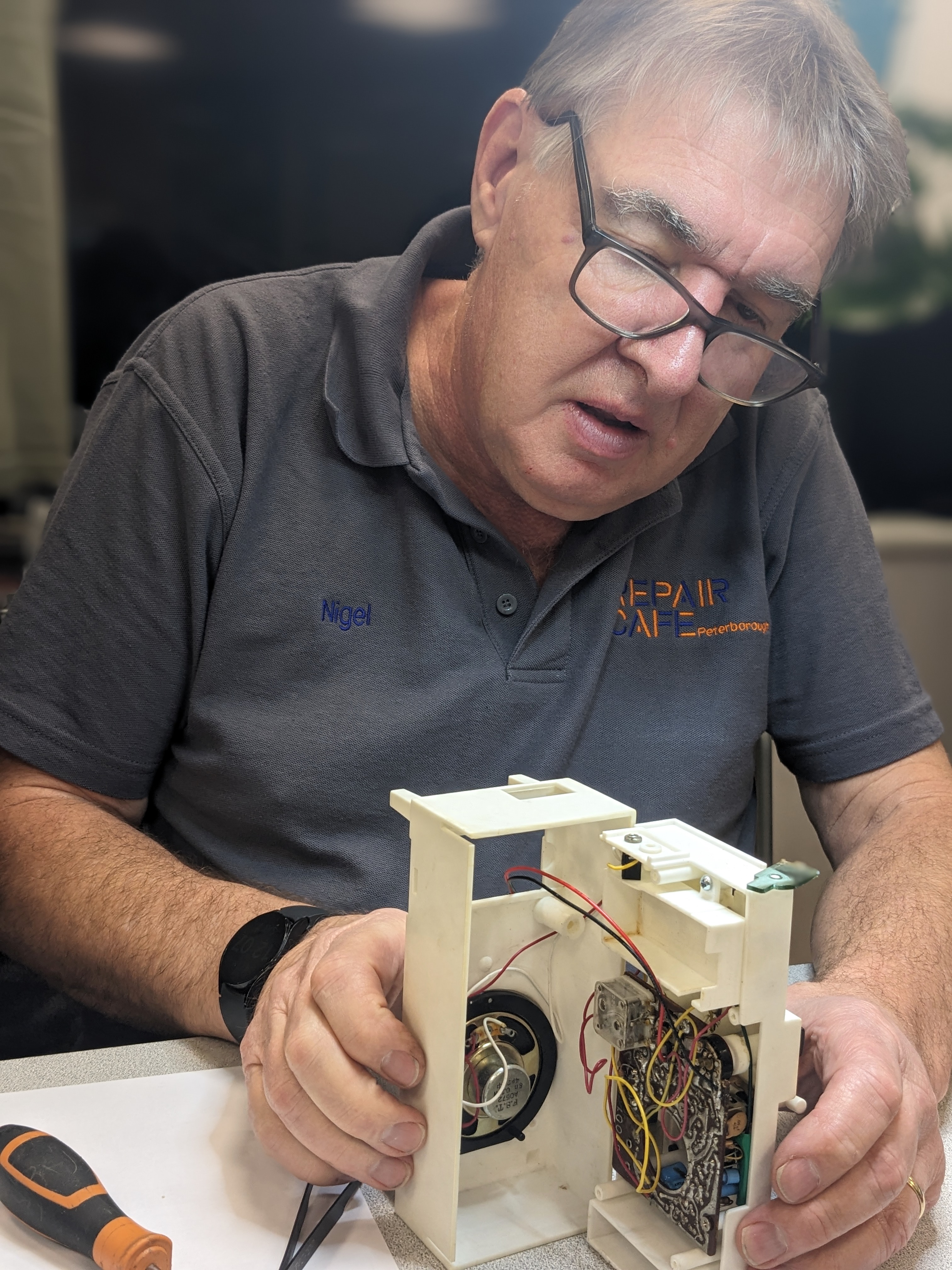Nigel fixing a Sindy radio — Tesco Community Room