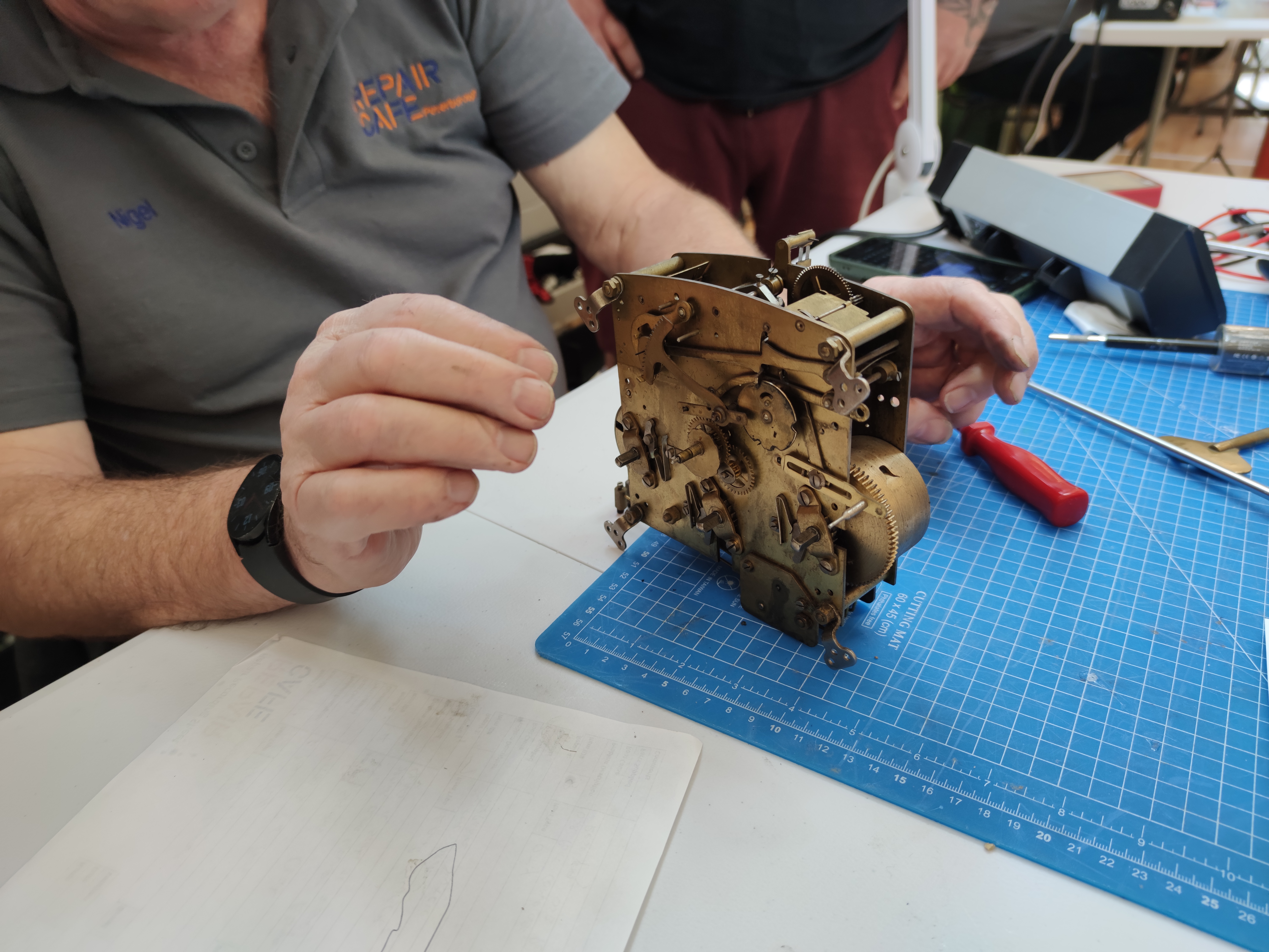 Volunteer Nigel with a clock — Gladstone