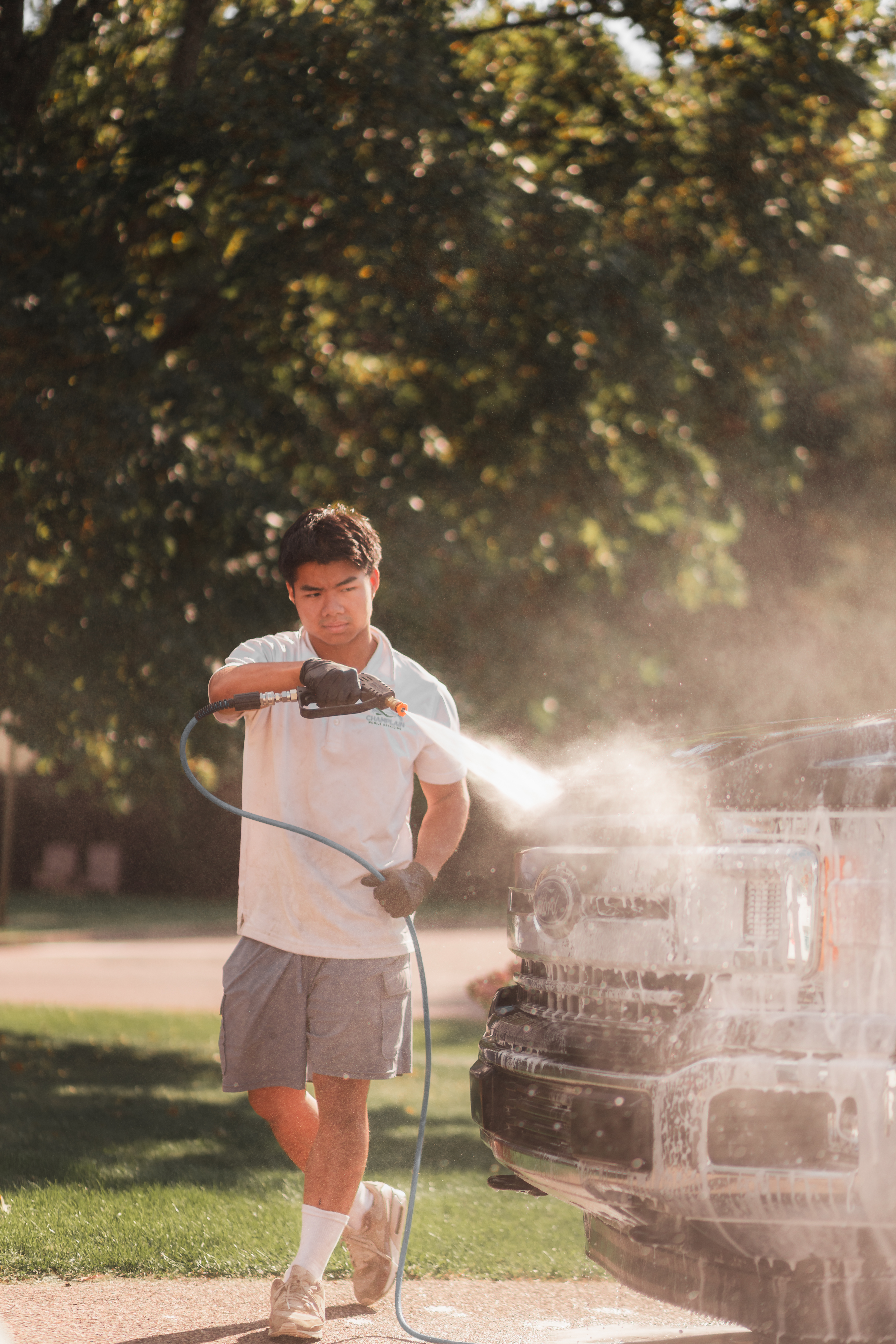Williston Mobile Detailing — pressure washing a vehicle on-site