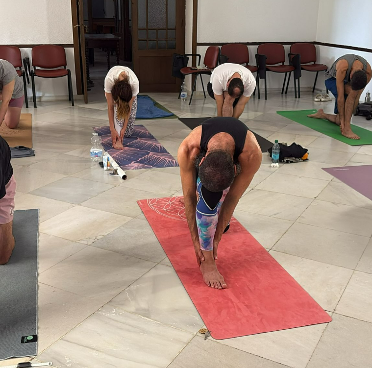 Workshop students in forward fold
