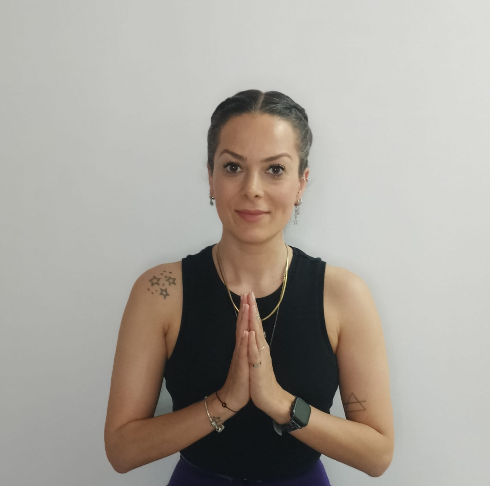 Yoga instructor in namaste pose