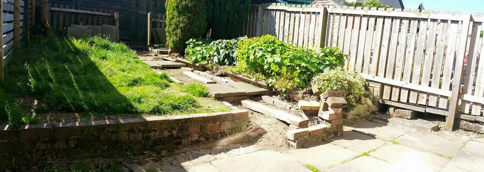 Small Garden with Grey Fence before