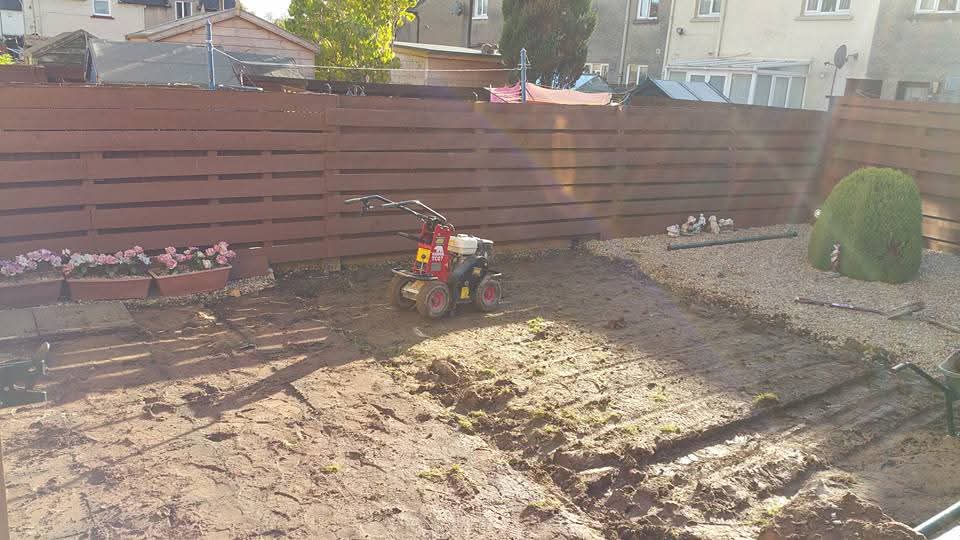 Fenced Garden with Stone Edging before